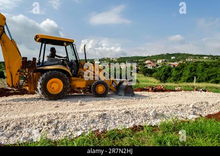 Einsatz eines Frontladers auf einer Marl Road Stockfoto