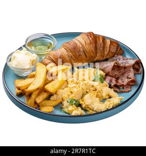 Amerikanisches Frühstücksrestaurant mit Rührei, Croissant, pommes frites, Speck, Butter und Honig Stockfoto
