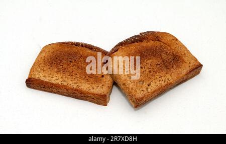 Zwei Stücke geschnittenes Brot, gebacken in einem Toaster Stockfoto