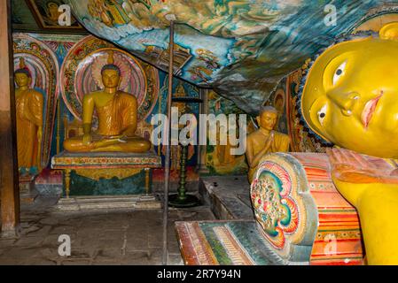 Buddha figures in the 1500-year-old and most important cultural-historical temple of the region Tangalle, the Mulkirigala Raja Maha Vihara. The Stock Photo