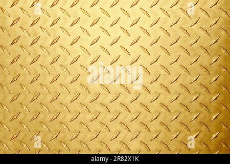 goldene Metallstruktur mit rhombischem Muster. Messing- oder Goldhintergrund Stockfoto