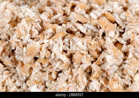 Dinkel-Weizenflocken (Triticum spelta) Dinkel-Weizenflocken Stockfoto