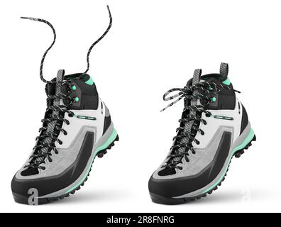 Neuer Sportwanderstiefel mit fliegenden Schnürsenkeln steht an der Spitze isoliert auf weißem Hintergrund. Winter Trekking Schuh mit Clipping Pfad. Volle Schärfentiefe Stockfoto