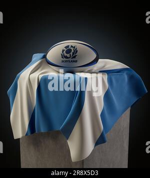 Eine 3D-Darstellung eines generischen Rugby-Balls mit dem schottischen Rugby-Ogo, das auf einer schottischen Flagge ruht - 29. März 2019 in Bristol, Vereinigtes Königreich Stockfoto