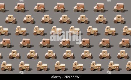 Hölzerne Autos auf grauem Hintergrund Stockfoto
