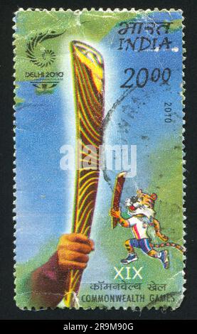 INDIEN - CIRCA 2010: Stempel gedruckt von Indien, zeigt Talisman von XIX Commonwealth Games, circa 2010 Stockfoto