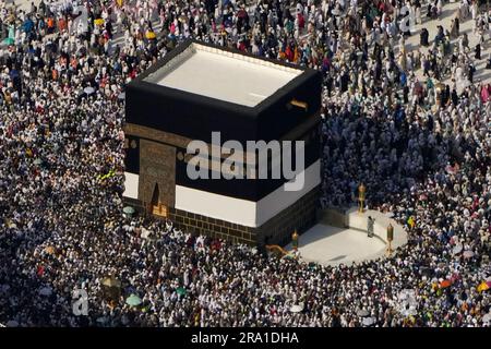 Muslim Pilgrims Circumambulate The Kaaba The Cubic Building At The 