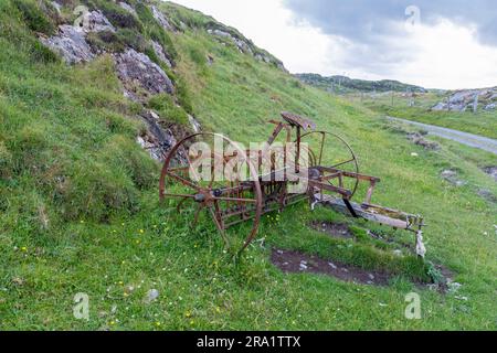 Verlassene Heumaschine ( Tumbling Tam) Bousd, Isle of Coll, Inner Hebrids, Schottland, Großbritannien. Stockfoto