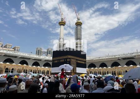 Muslim Pilgrims Circumambulate The Kaaba The Cubic Building At The 