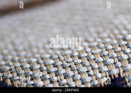 Strukturierter Hintergrund mit Mesh-Material, das Details, Nahaufnahmen und selektive Fokussierung erfasst. Stockfoto