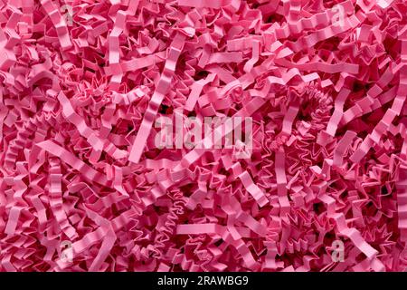 Rosafarbene Zerknitterte Papierstreifen – Nahaufnahme Des Hintergrunds. Stockfoto