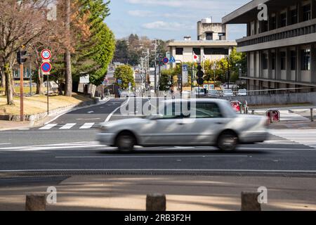 Bewegungsunschärfe in einem Taxi in den Straßen von Nara, Japan Stockfoto