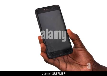 Schnittbild der Hand eines jungen Mannes mit einem Handy. Stockfoto