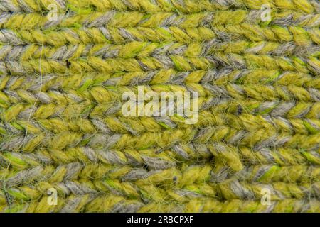 Hellgrüner Hintergrund von Strickpullover im Nahbereich Stockfoto
