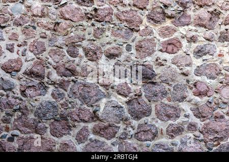 Alte Steinwand, Fotostruktur im Hintergrund, Vorderansicht Stockfoto