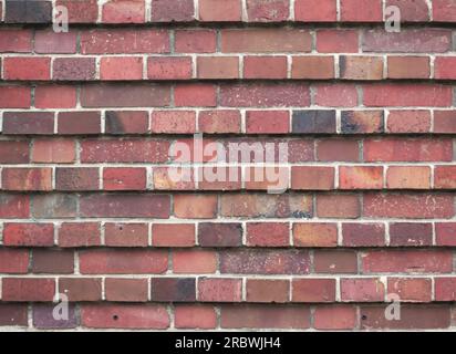 Rote Ziegeltextur in Schichten mit unterschiedlicher Hervorhebung. Stockfoto