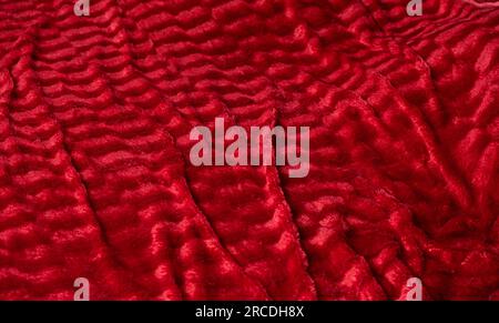 Textur aus warmem, weichem, rotem Tuch, langer Bannerhintergrund Stockfoto