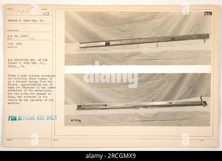 Das Foto, 111-SC-19908, zeigt einen Bombenauslösemechanismus für Michelin-Leuchtbomben bei der Edward G. Budd Mfg Co. In Philadelphia, PA, am 29. Mai 1918. Der Mechanismus ist eine modifizierte Version des französischen Designs. Es ist an der unteren Struktur der Flugzeuge befestigt, um die Platzierung und Freisetzung von mehreren Bomben zu ermöglichen. Der Bediener kann die Bomben mit zwei Hebeln auslösen. Dieses Bild ist nur zur offiziellen Verwendung vorgesehen. (Hinweis: Diese Bildunterschrift ist sachlich und nicht kreativ formuliert und bietet Informationen über das Foto ohne Verzierungen oder narrativen Elemente.) Stockfoto