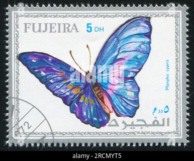 FUJEIRA - CIRCA 1972: Stempel gedruckt von Fujeira, zeigt Schmetterling, circa 1972 Stockfoto