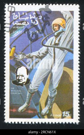 OMAN - CIRCA 1972: Stempel gedruckt von Oman, zeigt Astronaut und Winston Churchill, circa 1972 Stockfoto