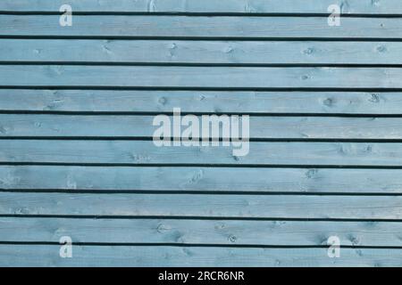 Blauer Holzplankhintergrund. Holzstruktur. Tapete. Vertikale Paneele. Verwitterte bemalte Holzwand. Klassische Kulisse. Scharf und stark deta Stockfoto