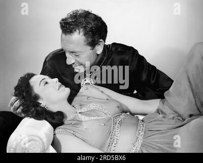 Patricia Medina, Paul Henreid, Drehort des Films, "Siren von Bagdad", Columbia Pictures, 1953 Stockfoto