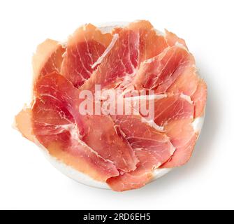 Platte mit geschnittenem spanischen Iberico-Schinken isoliert auf weißem Hintergrund, Draufsicht Stockfoto