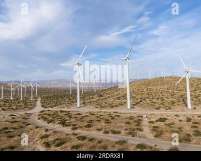 Air mills power station against the blue sky making alternative energy for the future Stock Photo