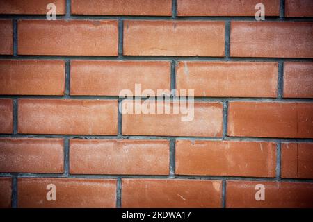 Ein roter Backsteinwand Hintergrund. Nahaufnahme. Stockfoto
