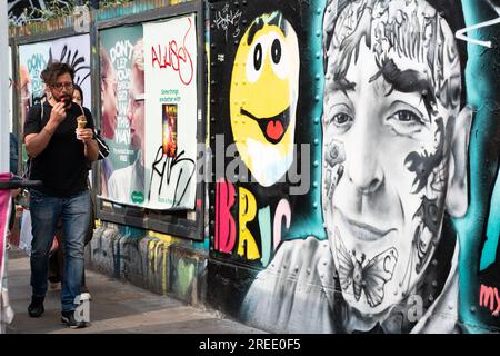 Gemalt an einer Wand in Brick Lane, London, England. Stockfoto