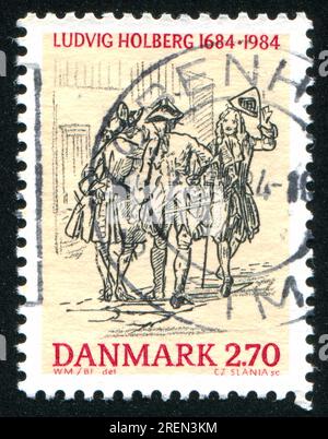 DÄNEMARK - CA. 1984: Briefmarke gedruckt von Dänemark, zeigt Holberg trifft sich mit einem Offizier, Wilhelm Marstrand, ca. 1984 Stockfoto
