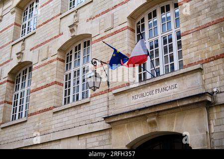 French and European Union flags fly above an administrative building in Paris, France Stock Photo