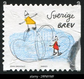 SCHWEDEN - CA. 2009: Briefmarke gedruckt von Schweden, zeigt Herzen und Menschen auf der Eisbahn, ca. 2009 Stockfoto