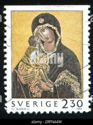 SCHWEDEN - CIRCA 1992: Von Schweden gedruckter Stempel zeigt Madonna und Kind, circa 1992 Stockfoto