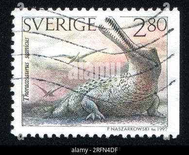SCHWEDEN - CIRCA 1992: Von Schweden gedruckter Stempel zeigt Thoracosaurus scanicus, circa 1992 Stockfoto