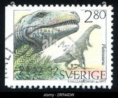 SCHWEDEN - CIRCA 1992: Von Schweden gedruckter Stempel zeigt Plateosaurus, circa 1992 Stockfoto
