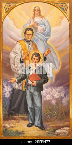 NEAPEL, ITALIEN - 21. APRIL 2023: Das Gemälde Jesu mit dem Heiligen Don Bosco, Dominic Savio in der Kirche Chiesa di Sacro Cuore von P. Camilleri (2006). Stockfoto