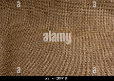 Sacktuch Textil abstrakte Textur Hellbraun Creme Gelb Beige Erdton. Stockfoto