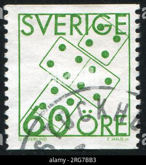 SCHWEDEN - CIRCA 1985: Von Schweden gedruckter Stempel, zeigt Domino, circa 1985 Stockfoto