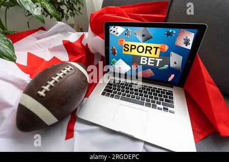 Laptop-Sportwetten und kanadische Flagge Stockfoto