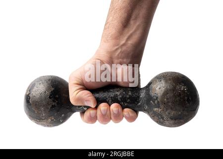 Alte gebrauchte und geschälte Kurzhantel in einer menschlichen Hand isoliert auf Weiß Stockfoto