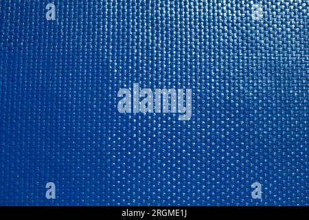 Blaue Textur. Feine Textur der Oberfläche von lackiertem Brett. Viele Punkte. Blendung an Bord. Stockfoto