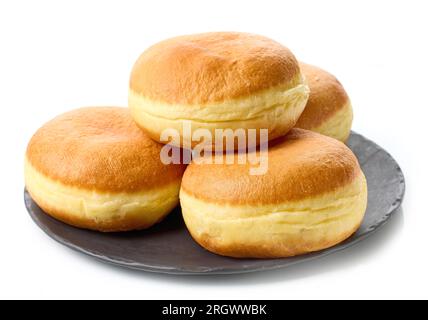 Frisch gebackene Jelly Donuts auf schwarzem Teller isoliert auf weißem Hintergrund Stockfoto