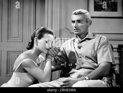 Jeanne Crain, Jeff Chandler, am Set des Films, "The Tattered Dress", Universal-International Pictures, 1957 Stockfoto