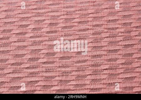 Stoffstruktur. Netzstruktur. Stoffstruktur mit Blumen. Schnurstruktur, Netzgewebe. Schwarzer Synthetikstoff. Kann als Hintergrund verwendet werden Stockfoto