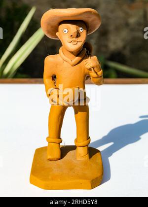 Small clay statue that portrays the northeastern man, for sale to tourists in Northeast Brazil. Stock Photo