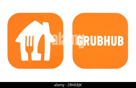 Kiew, Ukraine - 17. Januar 2023: Beliebte Symbole für Mobile Apps für die Lebensmittellieferung, gedruckt auf Papier: Take-Away und GrubHub Stockfoto