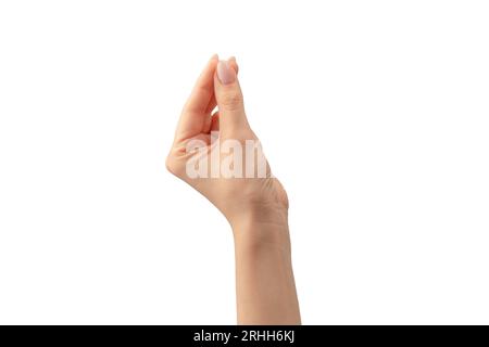 Die Hand einer Frau hält ein winziges oder dünnes Objekt, isoliert auf einem weißen Hintergrund. Stockfoto