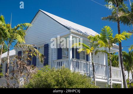 Key West, Florida, USA. Balcony of a typical wooden house framed by tropical vegetation, Old Town. Stock Photo