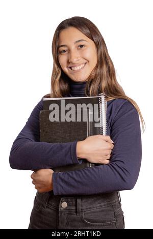 Lächelndes lateinisches Mädchen mit Büchern isoliert auf weißem Hintergrund. Stockfoto